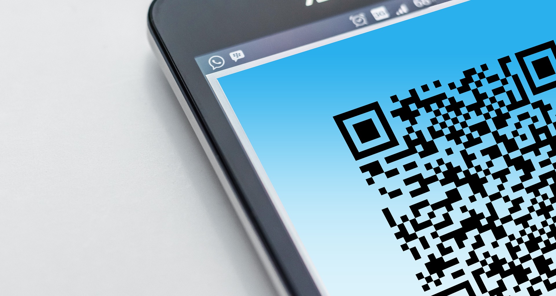 How can you utilize a QR code scanner in a web app?